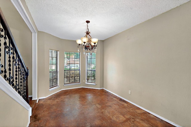 1523 Allen Dr, Cedar Hill, TX 75104 - unfurnished dining area featuring baseboards, a chandelier, concrete flooring, and a textured ceiling
