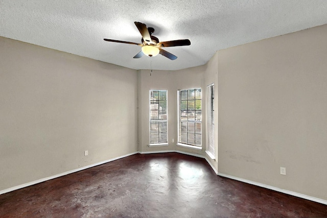 1523 Allen Dr, Cedar Hill, TX 75104 - spare room with concrete floors, ceiling fan, baseboards, and a textured ceiling