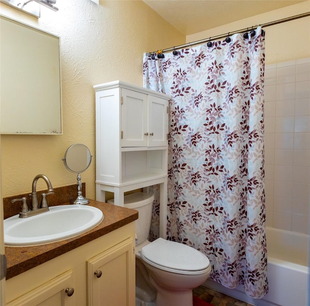404 Jones St, Cedar Hill, TX 75104 - bathroom with a textured wall, toilet, shower / bath combo with shower curtain, and vanity