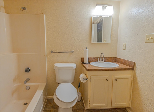 404 Jones St, Cedar Hill, TX 75104 - full bath with vanity, toilet,  shower combination, tile patterned floors, and a textured wall