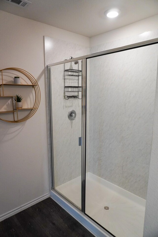 3128 Bettin Dr, Mesquite, TX 75126 - bathroom with wood finished floors, a stall shower, and baseboards