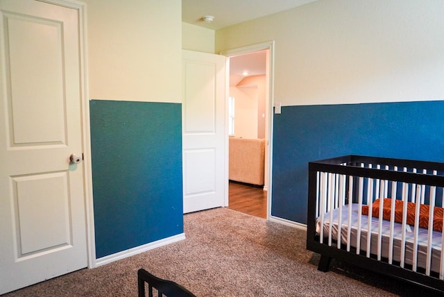 3128 Bettin Dr, Mesquite, TX 75126 - carpeted bedroom featuring a nursery area and baseboards