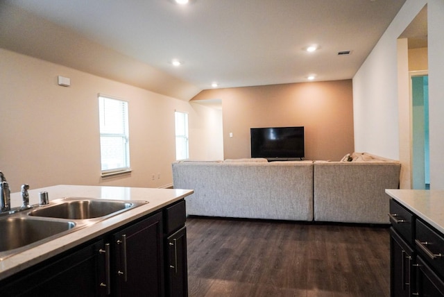 3128 Bettin Dr, Mesquite, TX 75126 - kitchen featuring dark cabinets, a sink, light countertops, open floor plan, and recessed lighting