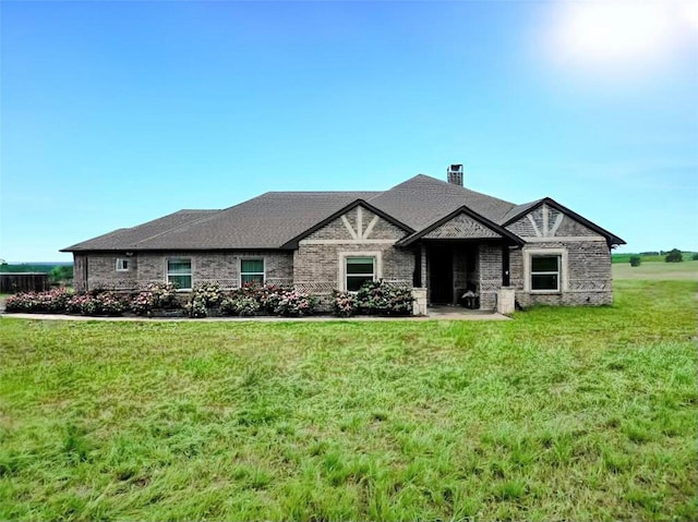 1061 N Whitt Rd, Perrin, TX 76486 - french country style house with a chimney, a front lawn, and stone siding