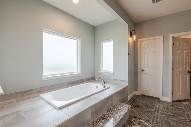 1061 N Whitt Rd, Perrin, TX 76486 - bathroom with healthy amount of natural light and a bath
