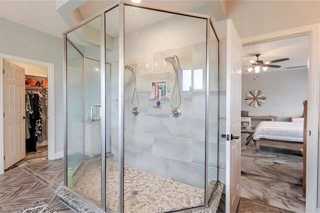 1061 N Whitt Rd, Perrin, TX 76486 - full bathroom with connected bathroom, a stall shower, ceiling fan, and a spacious closet