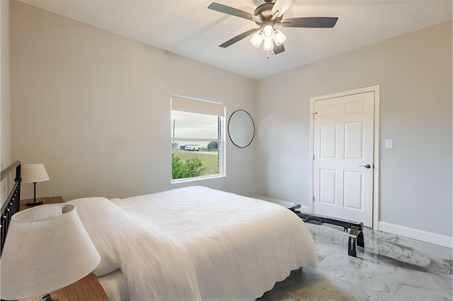 1061 N Whitt Rd, Perrin, TX 76486 - bedroom featuring baseboards, a ceiling fan, and marble finish floors