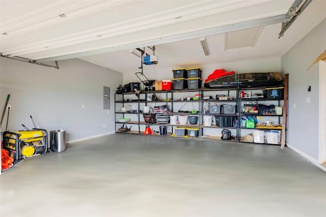 1061 N Whitt Rd, Perrin, TX 76486 - garage featuring a garage door opener, electric panel, and baseboards