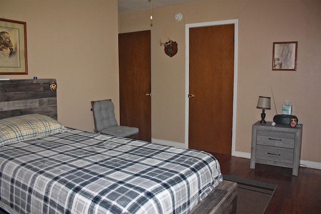 205 N Texas St, Whitney, TX 76692 - bedroom with wood finished floors and baseboards