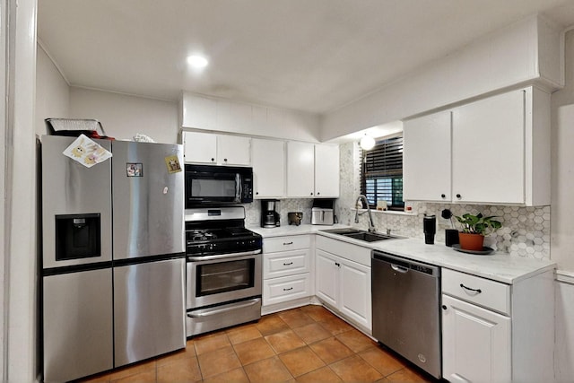 2422 Sue Cir, Mesquite, TX 75149 - kitchen with appliances with stainless steel finishes, white cabinetry, backsplash, and light countertops