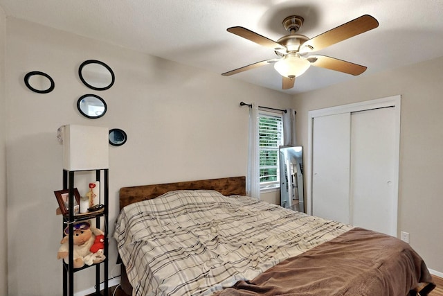 2422 Sue Cir, Mesquite, TX 75149 - bedroom with a closet, a ceiling fan, and wood finished floors