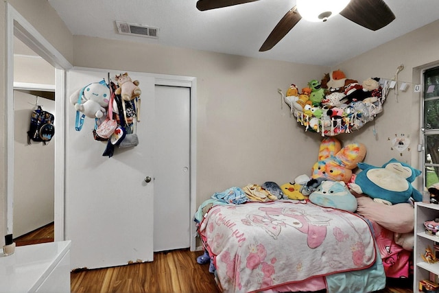 2422 Sue Cir, Mesquite, TX 75149 - bedroom with wood finished floors, a closet, and a ceiling fan