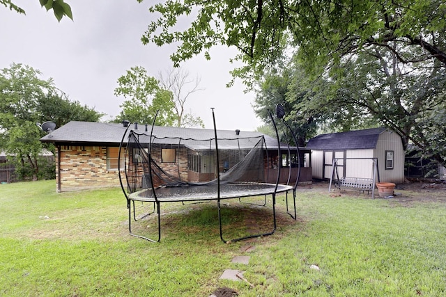 2422 Sue Cir, Mesquite, TX 75149 - view of grassy yard with a trampoline and a storage shed