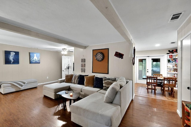 2422 Sue Cir, Mesquite, TX 75149 - living room featuring beamed ceiling, dark wood-style flooring, and a ceiling fan