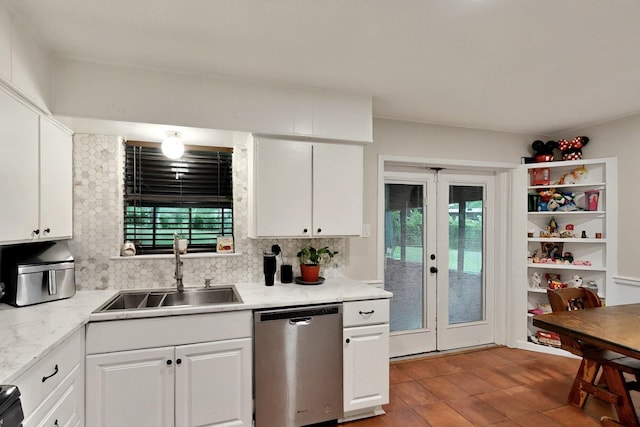 2422 Sue Cir, Mesquite, TX 75149 - kitchen with stainless steel dishwasher, french doors, backsplash, white cabinetry, and light countertops
