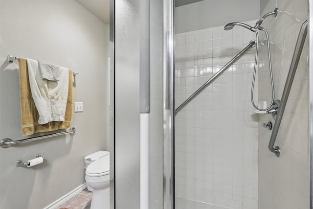 1233 Fox Hunt Trl, Willow Park, TX 76087 - bathroom featuring a stall shower, toilet, and baseboards