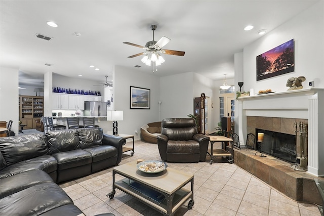 1233 Fox Hunt Trl, Willow Park, TX 76087 - living room featuring a ceiling fan, light tile patterned floors, a tile fireplace, recessed lighting, and baseboards