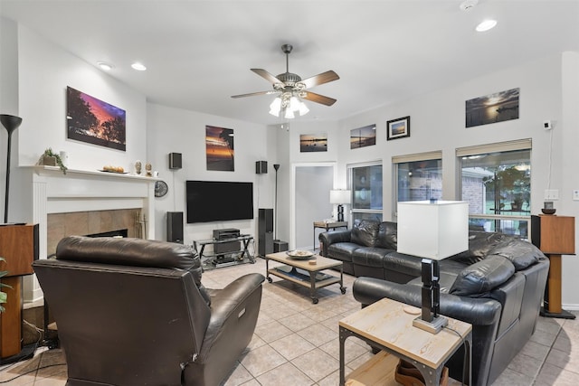 1233 Fox Hunt Trl, Willow Park, TX 76087 - living room featuring light tile patterned floors, ceiling fan, a tile fireplace, and recessed lighting