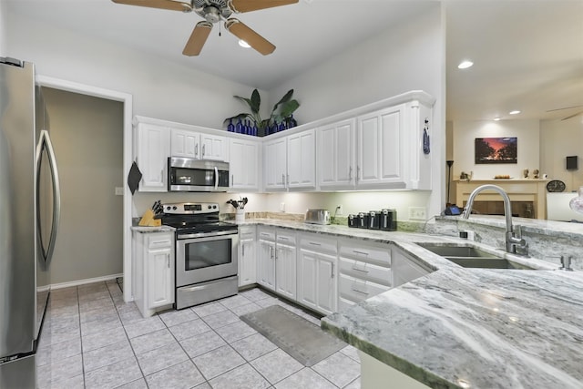 1233 Fox Hunt Trl, Willow Park, TX 76087 - kitchen with appliances with stainless steel finishes, a sink, ceiling fan, white cabinets, and recessed lighting