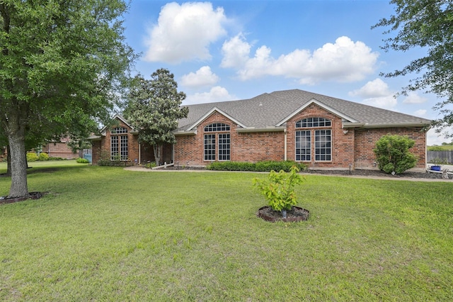 1233 Fox Hunt Trl, Willow Park, TX 76087 - view of front of home with a front yard, brick siding, and roof with shingles