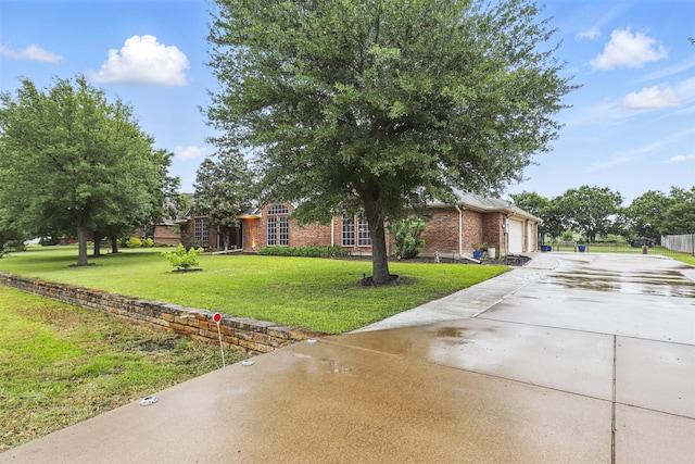 1233 Fox Hunt Trl, Willow Park, TX 76087 - view of front facade with driveway, brick siding, a front yard, and a garage