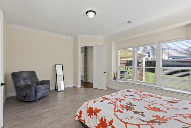 bedroom with crown molding and baseboards