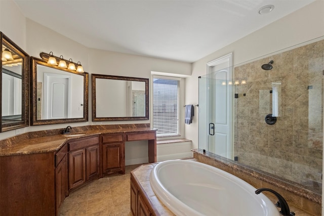bathroom featuring a shower stall, a bath, and vanity
