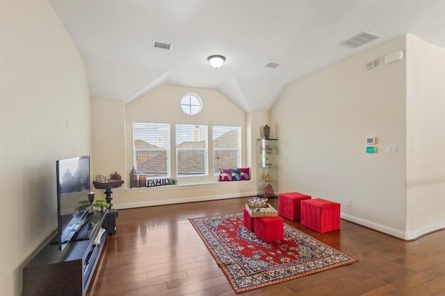 game room with hardwood / wood-style floors, baseboards, and vaulted ceiling