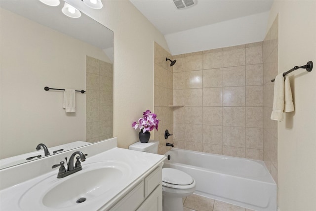 bathroom featuring toilet, vanity, tile patterned flooring, and  shower combination