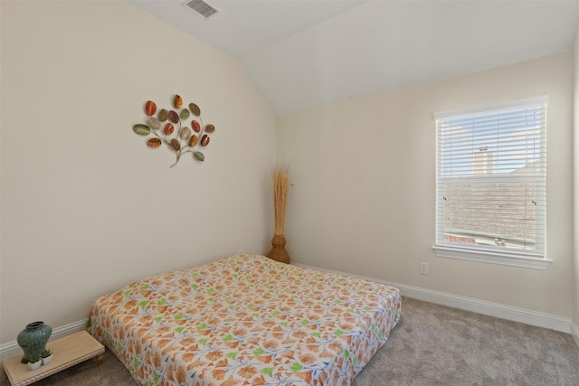 bedroom featuring multiple windows, lofted ceiling, light colored carpet, and baseboards