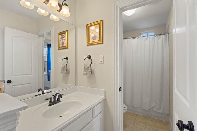 bathroom with tile patterned floors, vanity, toilet, and shower / bath combo with shower curtain