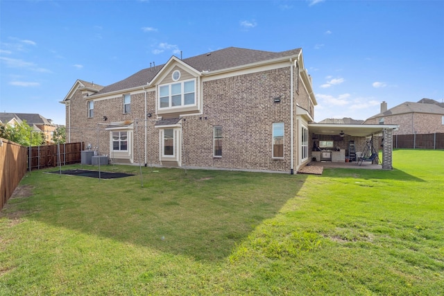 rear view of house with a patio area, a ceiling fan, brick siding, and central AC unit