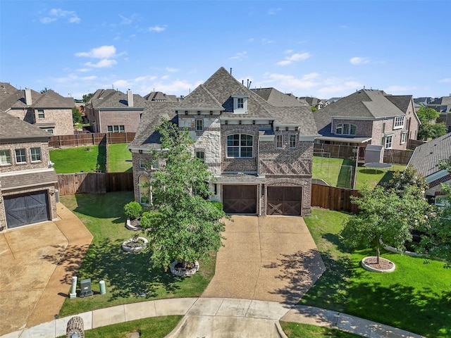 french country inspired facade featuring a residential view, a garage, driveway, and stone siding