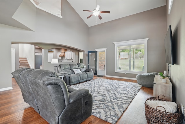 1844 Sweet Gum Dr, Anna, TX 75409 - living area with a ceiling fan, arched walkways, high vaulted ceiling, wood finished floors, and baseboards