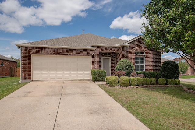 1300 Shelby Ct, Wylie, TX 75098 - view of front of home featuring brick siding, concrete driveway, an attached garage, and roof with shingles