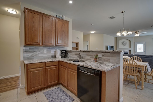 1300 Shelby Ct, Wylie, TX 75098 - kitchen featuring dishwasher, a sink, light stone countertops, light tile patterned flooring, and backsplash