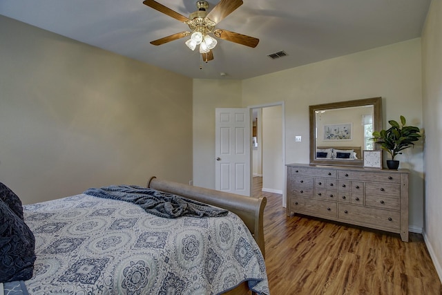 1300 Shelby Ct, Wylie, TX 75098 - bedroom with wood finished floors, baseboards, and ceiling fan