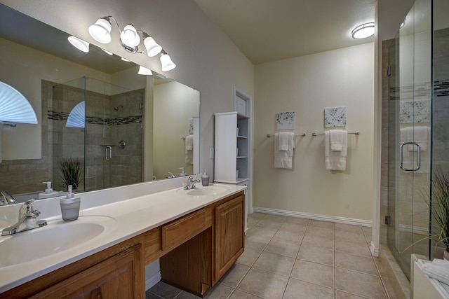 1300 Shelby Ct, Wylie, TX 75098 - bathroom with a stall shower, tile patterned floors, double vanity, and baseboards