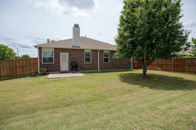 1300 Shelby Ct, Wylie, TX 75098 - rear view of house featuring a patio area, a chimney, brick siding, and roof with shingles