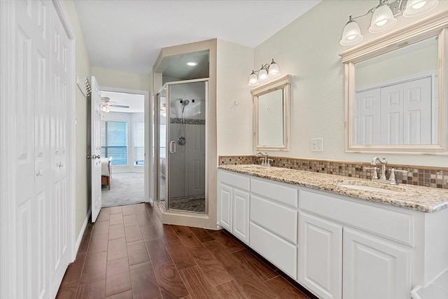 1717 Adams Ln, Azle, TX 76020 - bathroom with a shower stall, double vanity, a ceiling fan, and ensuite bath