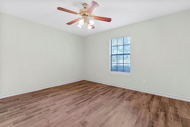 1717 Adams Ln, Azle, TX 76020 - spare room with wood finished floors, baseboards, and a ceiling fan