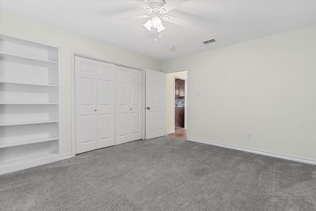 1717 Adams Ln, Azle, TX 76020 - unfurnished bedroom with carpet, baseboards, ceiling fan, and a closet