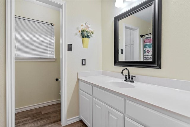 1717 Adams Ln, Azle, TX 76020 - full bath featuring wood finished floors, baseboards, and vanity