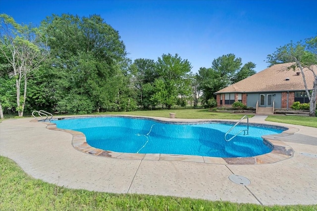 1717 Adams Ln, Azle, TX 76020 - outdoor pool with a lawn and view of wooded area