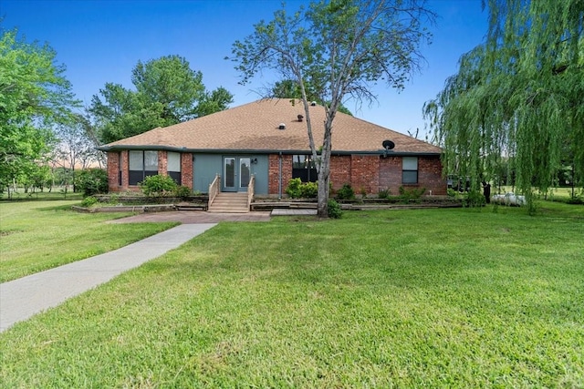 1717 Adams Ln, Azle, TX 76020 - single story home with brick siding, a front yard, and french doors