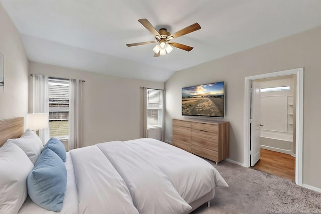 4612 Corktree Ln, Fort Worth, TX 76036 - bedroom featuring light colored carpet, multiple windows, baseboards, vaulted ceiling, and connected bathroom