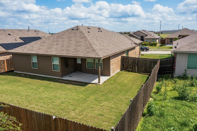 4612 Corktree Ln, Fort Worth, TX 76036 - rear view of house featuring a shingled roof, a patio, a residential view, and brick siding