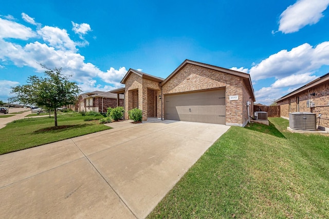 4612 Corktree Ln, Fort Worth, TX 76036 - view of front of home featuring central AC, driveway, an attached garage, and brick siding