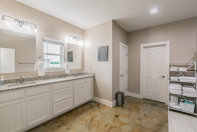 505 Advance Rd, Weatherford, TX 76088 - full bathroom featuring baseboards, double vanity, a closet, and concrete floors