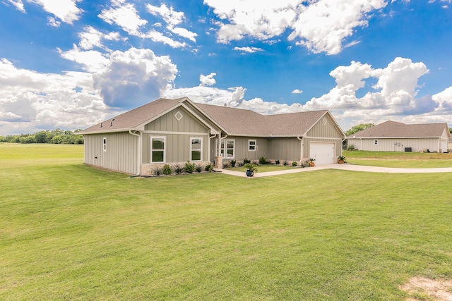 505 Advance Rd, Weatherford, TX 76088 - view of front facade with a garage, driveway, a front lawn, and board and batten siding